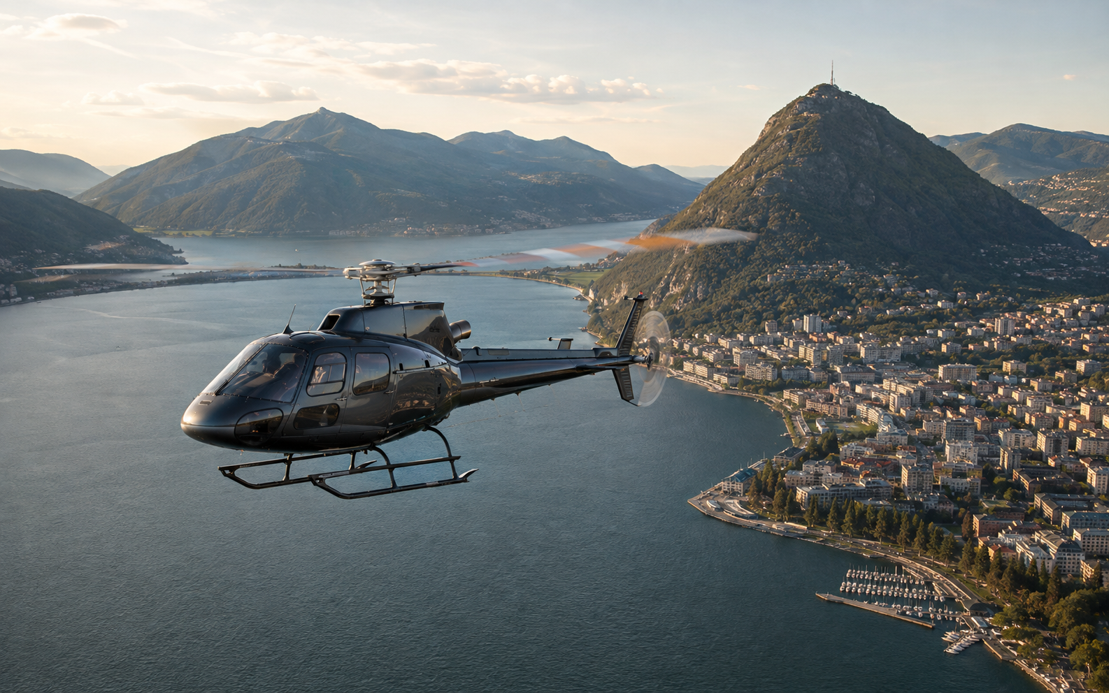 Civil helicopter flying over the Bay of Lugano